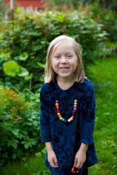 Little girl outdoors on a beautiful summer afternoon