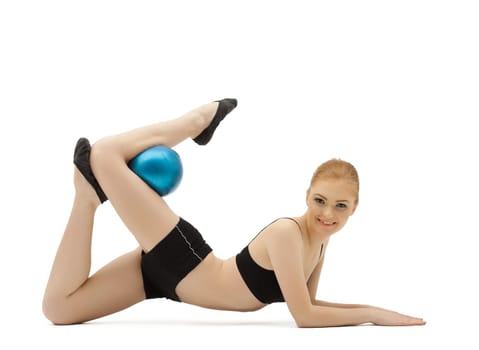 young girl as gymnast in black cloth posing with blue ball isolated