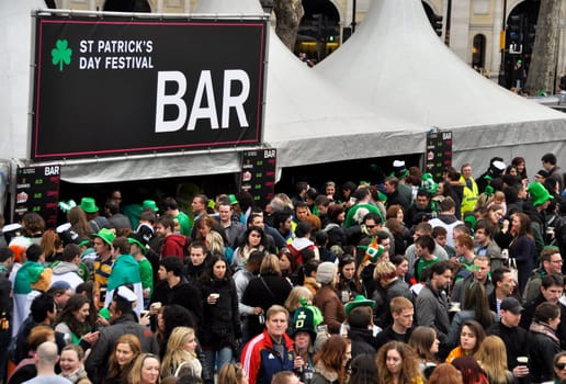 LONDON - MARCH 18: The crowd during the St Patrick&#039 s Day Parade and Festival at Trafalgar Square on March 18, 2012 in London, UK.