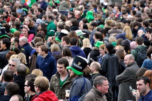 LONDON - MARCH 18: The crowd during the St Patrick&#039 s Day Parade and Festival at Trafalgar Square on March 18, 2012 in London, UK.