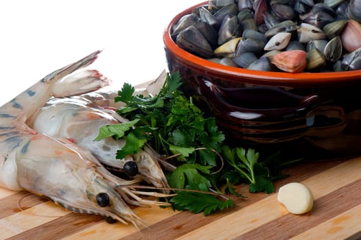 giant clams and shrimp on a wooden cutting board bamboo