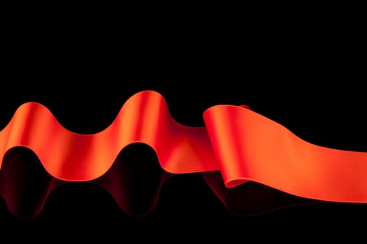 Red ribbon banner on black background