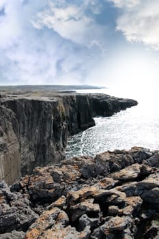 view from the cliffs edge on a rocky landscape of the burren in county clare ireland