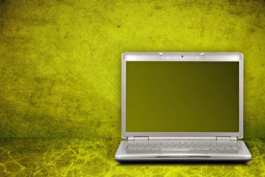 silver computer on green and dirty background