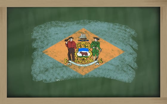 Chalky american state of delaware flag painted with color chalk on old blackboard