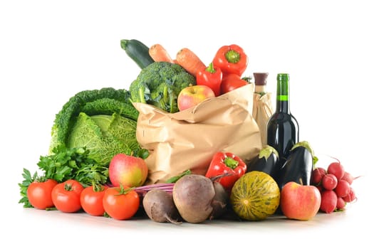 Composition with raw vegetables shopping bag isolated on white