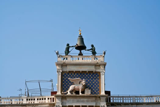 famous clocktower of venice with the old city flag and the lion, venice, Italy