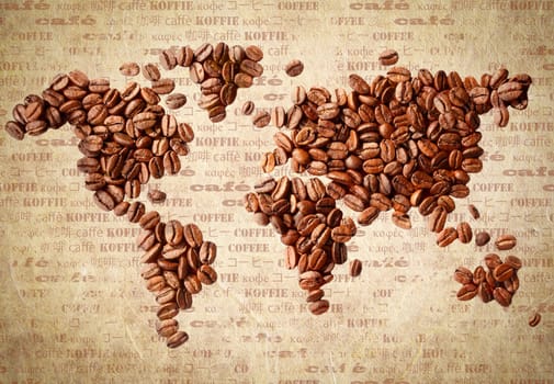 Fresh roasted coffee beans arranged in the shape of a world map on aged vintage paper with the word coffee in multiple languages.