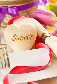 Romantic background with a heart inscribed with the word Forever, an avowal of lifelong commitment in love