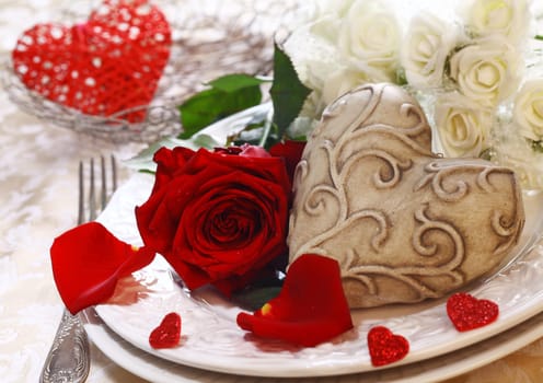 Place Setting with a place card, red and white roses and a heart
