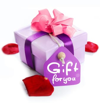 violet Gift Box with a card, a ribbon and the words Gift for you. Red Rose leaves isolated on white background