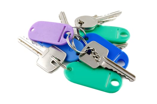 Old silver keys with keyholder on white background
