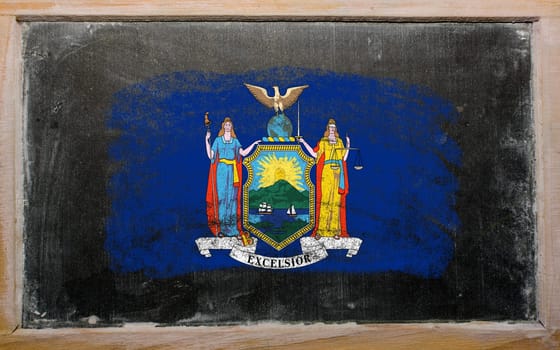 Chalky american state of new york flag painted with color chalk on old blackboard