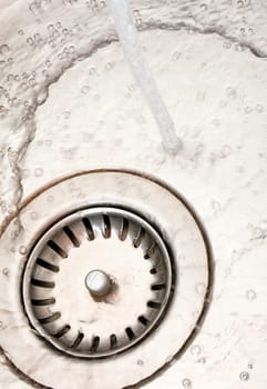 Close-up of kitchen sink with flowing water