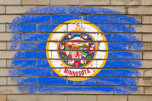 Chalky and grunge american state of minnesota flag painted with color chalk on brick wall