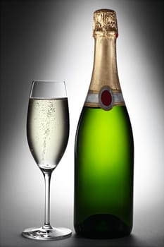 Champagne bottle with champagne glass.