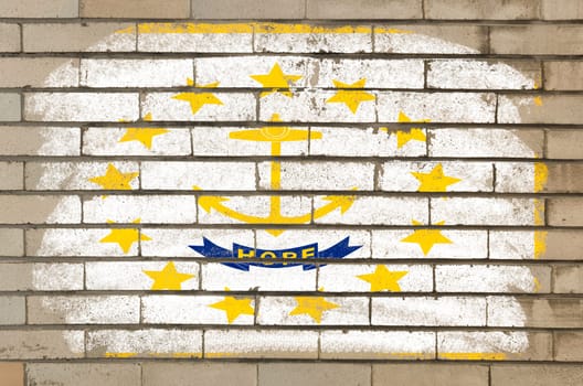 Chalky and grunge american state of rhode island flag painted with color chalk on brick wall