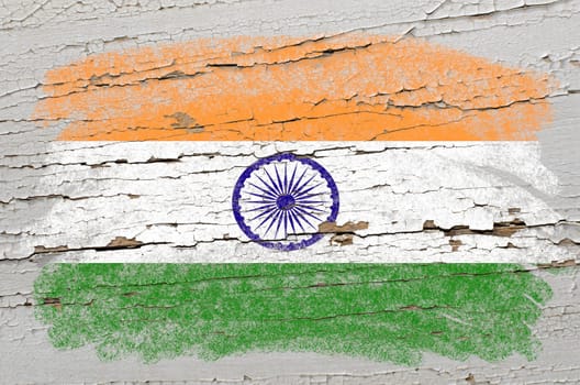 Chalky india flag precisely painted with color chalk on grunge wooden texture