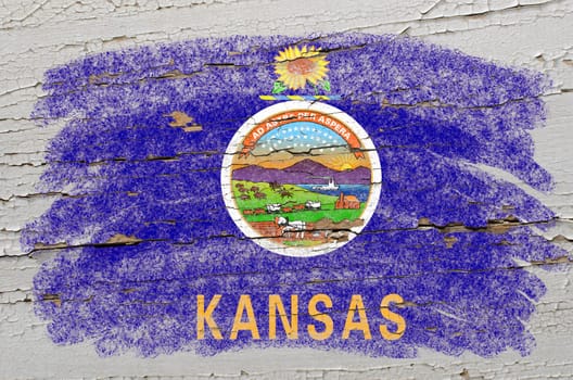 Chalky american state of kansas flag precisely painted with color chalk on grunge wooden texture