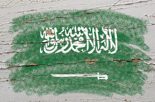 Chalky saudi arabia flag precisely painted with color chalk on grunge wooden texture