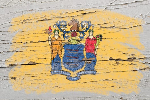 Chalky american state of new jersey flag precisely painted with color chalk on grunge wooden texture