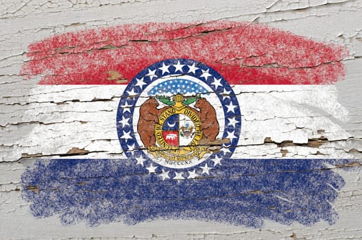 Chalky american state of missouri flag precisely painted with color chalk on grunge wooden texture