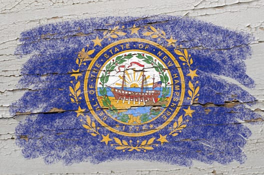 Chalky american state of new hampshire flag precisely painted with color chalk on grunge wooden texture