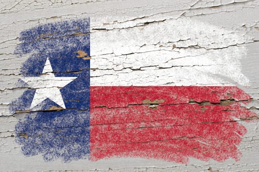 Chalky american state of texas flag precisely painted with color chalk on grunge wooden texture