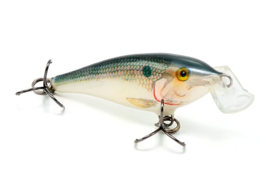 Artificial fish with hooks for fishing in depredaores surface flat on white background