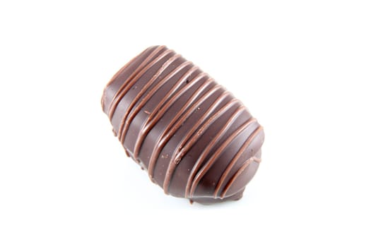chocolate bonbon filled black liquor and white horizontal