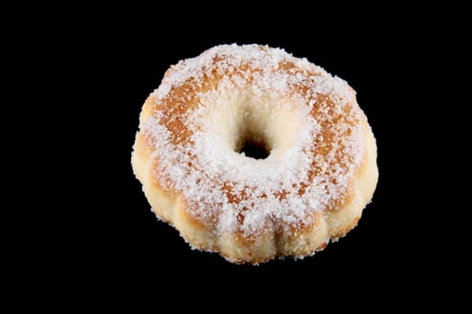 Donut home sugar made with butter sugar flour and eggs isolated on a black background