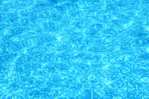Aqua blue water background in swimming pool