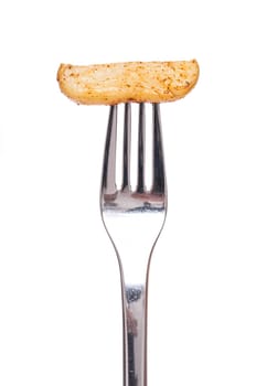Fork with a potato marinated with spices