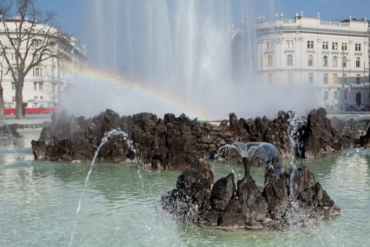 Hochstrahlbrunnen Schwarzenbergplatz,Vienna,in the center of the city with rainbow