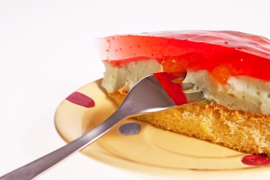 Dessert cake with jelly lying on the plate