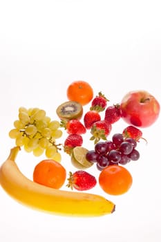 Close up of different fruits isolated over white