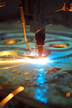 Laser cutting metal sheet