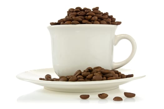 white cup full of roasted coffee beans