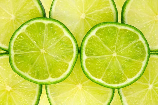 close-up image of fresh green lemon slices
