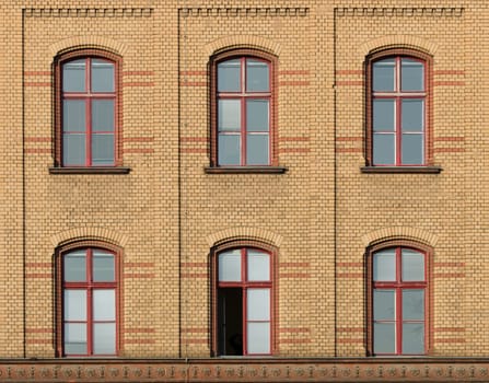 Brick house façade with six windows