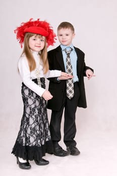Smiling boy and girl hold each other&#039 s hand