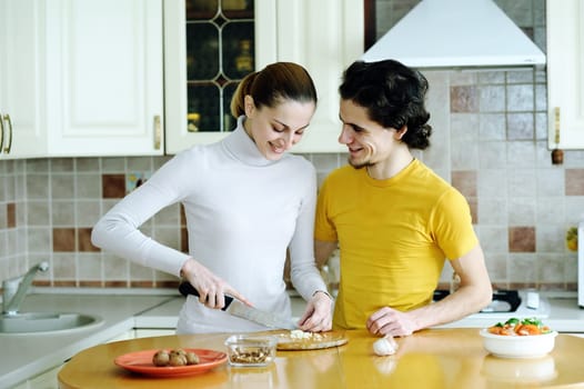An image of couple in the kichen preparing vegetarian food