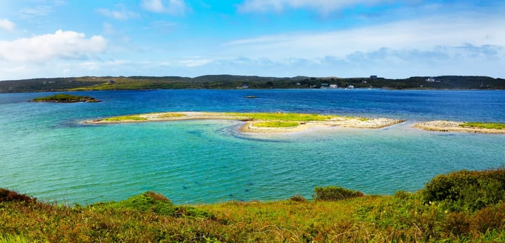 Small islands at Clifden Bay in summer, Conemara, Ireland.