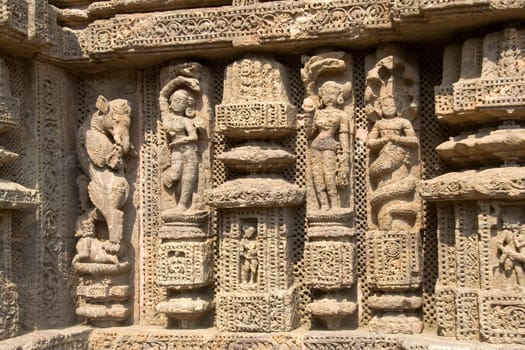 Depiction of mythological characters by deft hands on wall of Sun Temple, Konark, Orissa, India, Asia