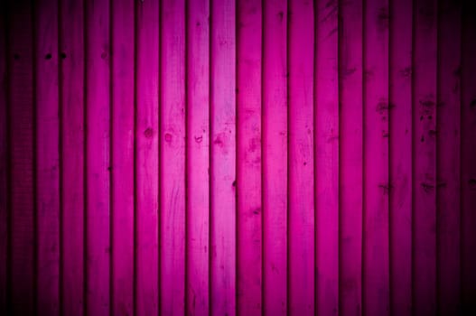 Pink wood wall background with vignette