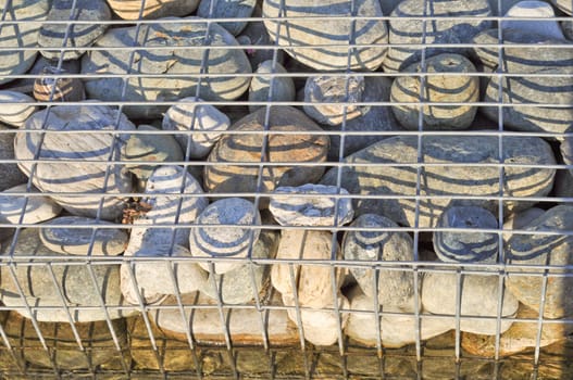 Detail of stones in a steel cage