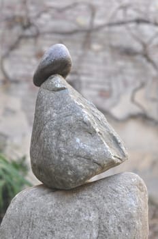 Balanced stones sculpture over blurred background
