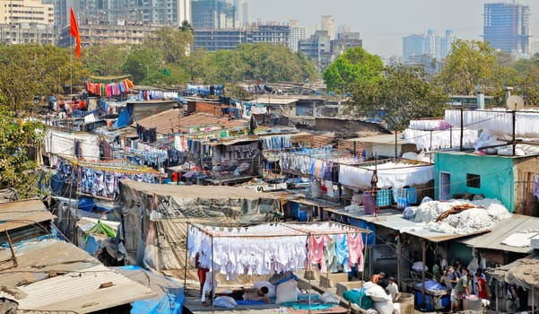 landscape oo Dhobhi Ghat Mumbai, India with orange flag flying in the breeze