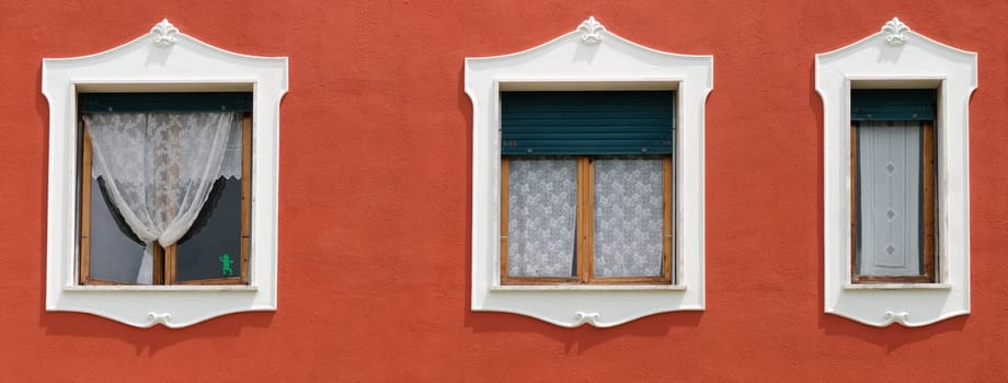 panoramic photo with three windows with decorations