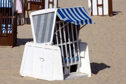 Single blue beach chair on the beach of the Baltic Sea